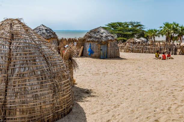 The small dwellings are constructed from doum palm fronds, animal skins, timber. The village girls in distance. Copy space.
Eliye Springs, Lake Turkana, Kenya, Africa, June 15, 2018: